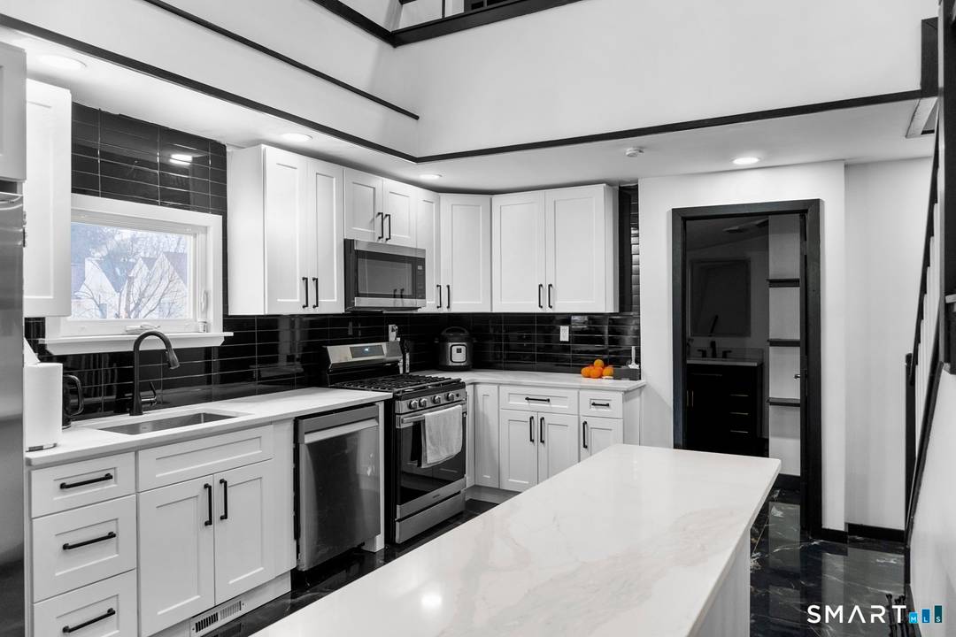 Welcome to 17 19 Silver Lane, East Hartford a fully reimagined mixed use masterpiece blending historic charm with modern luxury.