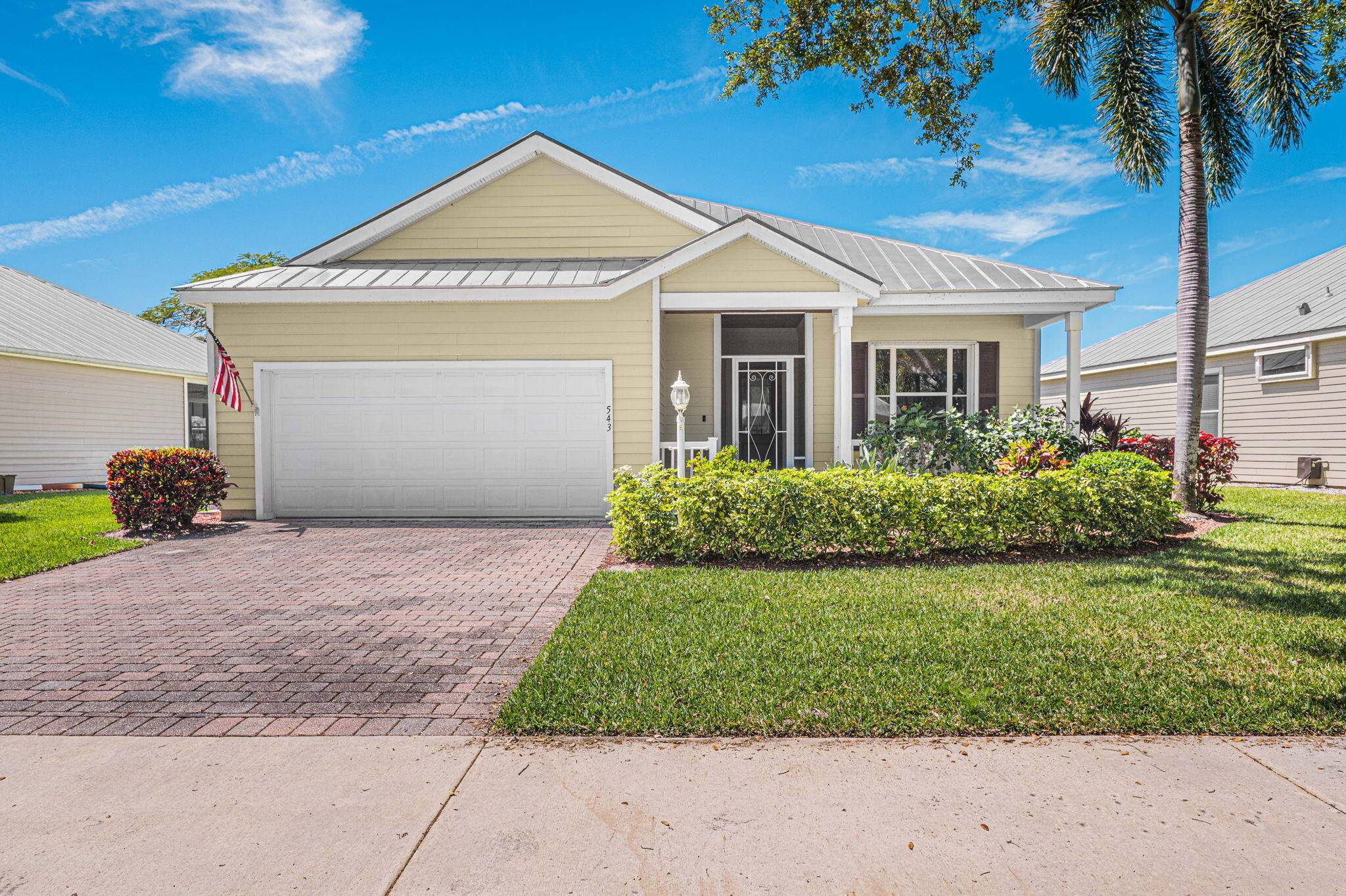 Charming Key West style furnished lakefront home with an extended family room screened lanai.