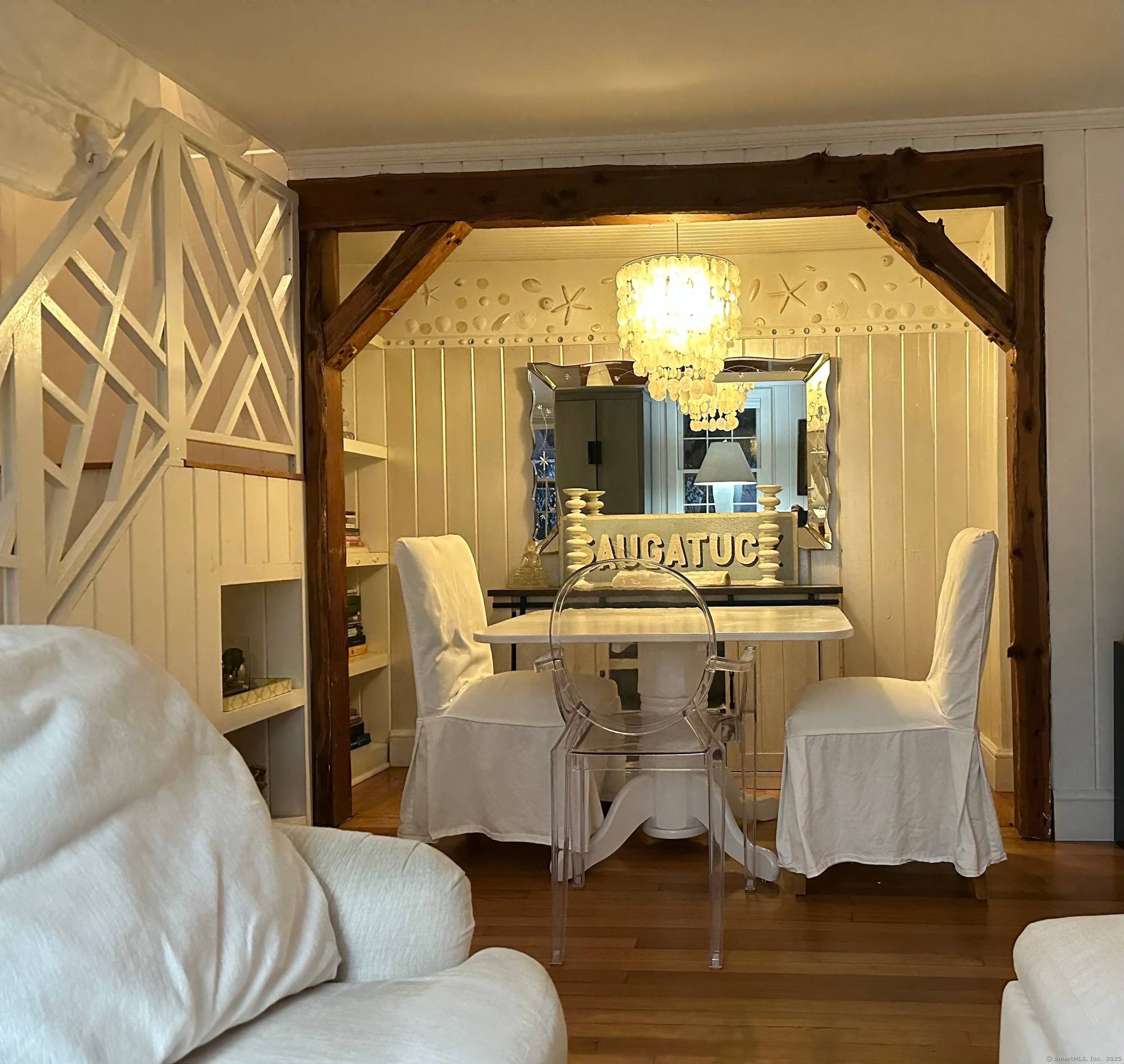 Cloud 9 is a sweet pink cottage by the shore reminiscent of childhood days at the beach.