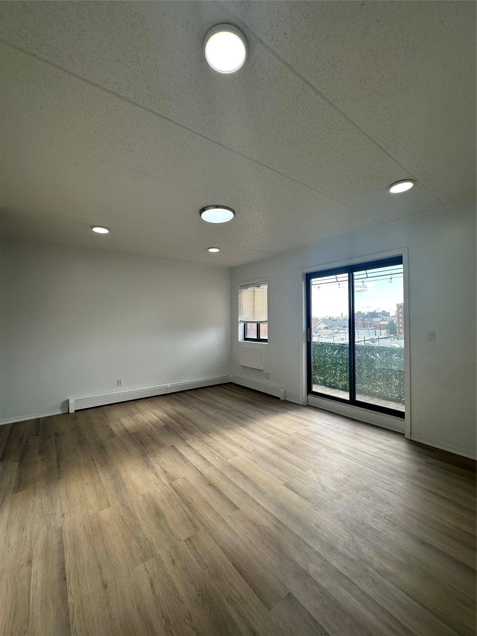Say goodbye to circling the block this fully renovated 2 bedroom, 2 bath condo comes with its own deeded parking space, a true luxury in Queens.