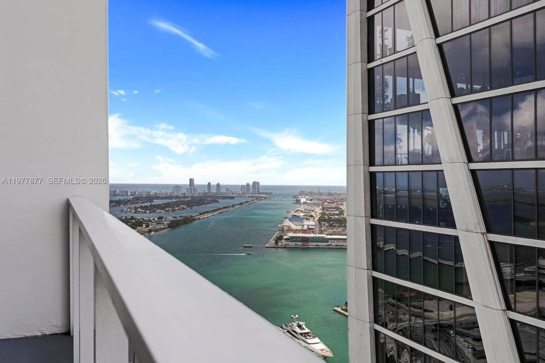Stunning 1 bedroom, 1. 5 bath residence at Ten Museum Park featuring floor to ceiling windows, abundant natural light, and a spacious balcony with breathtaking ocean and city views from ...