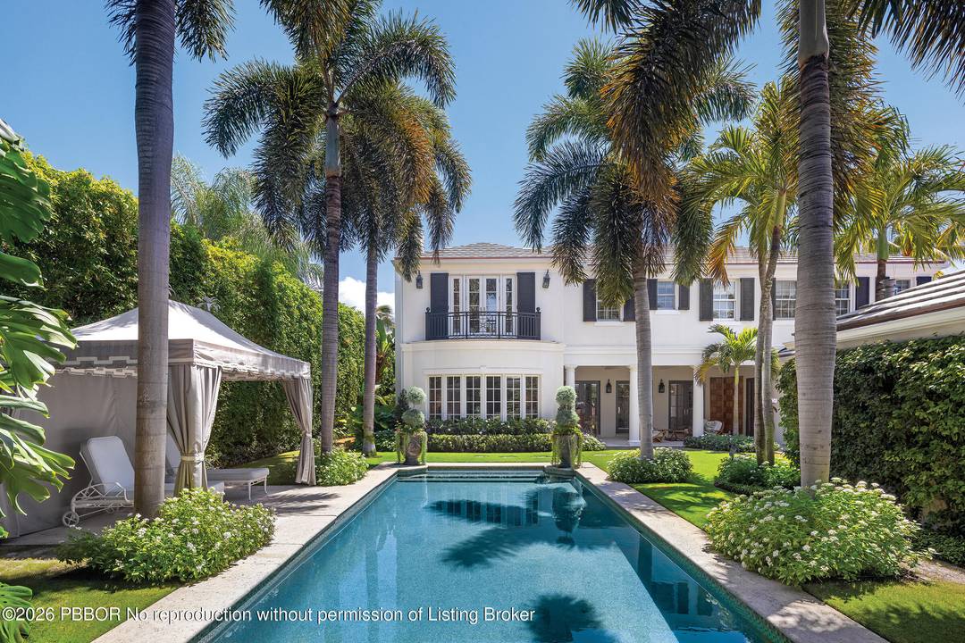 Welcome to 231 Coral Lane, a quintessential Palm Beach retreat where warmth, elegance, and effortless indoor outdoor living come together in perfect harmony.