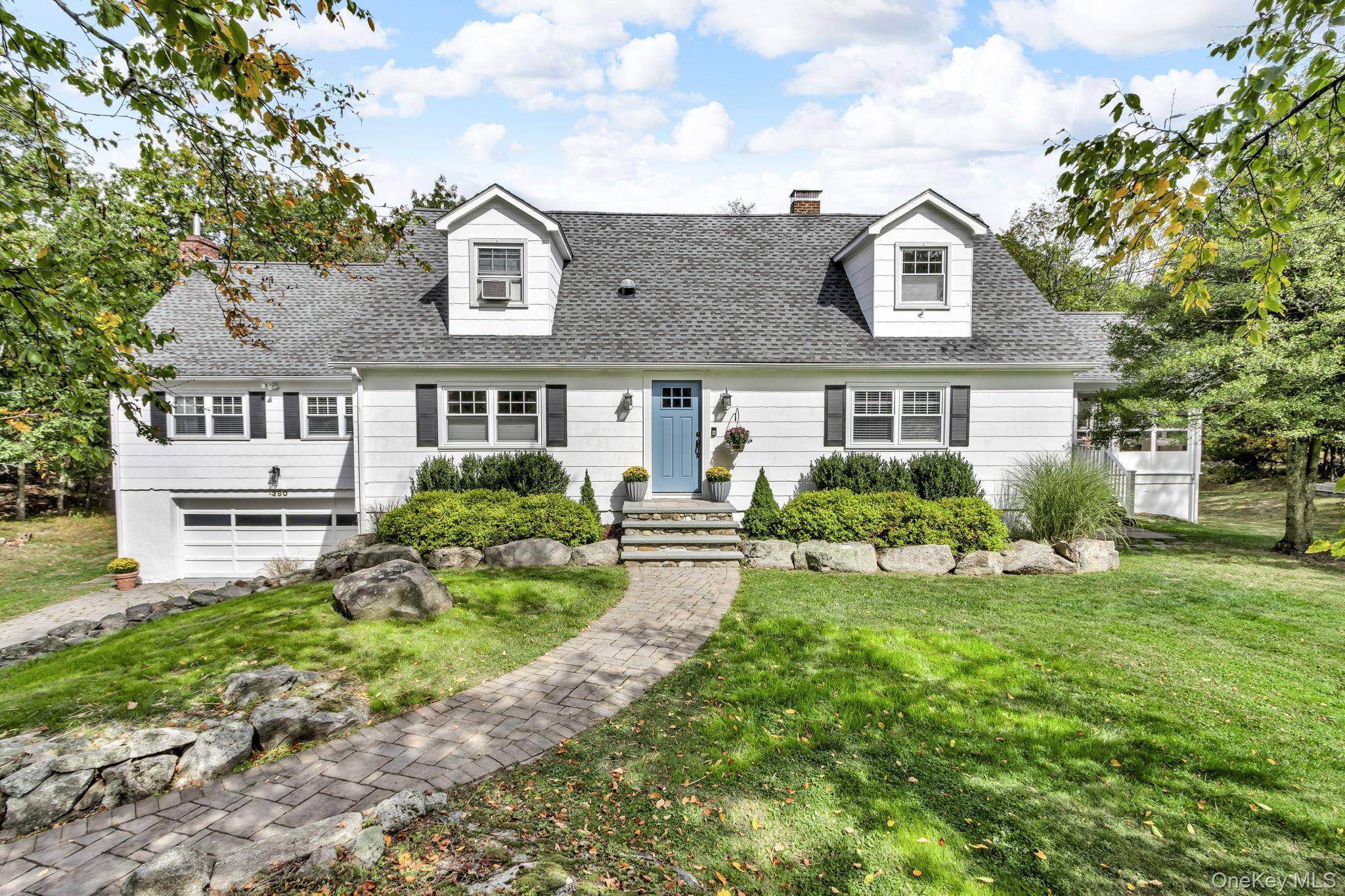 DISCOVER PEACEFUL COUNTRY LIVING in this Cape Cod charmer.
