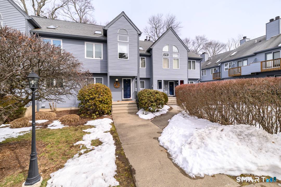 Pristine townhouse nestled in a small, well maintained complex in Norwalk.
