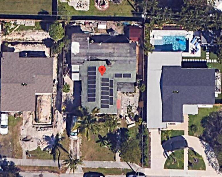 Traditional Old Florida charm meets modern sustainability in this CBS constructed home featuring a Tesla solar panel roof and a new 2023 AC system.