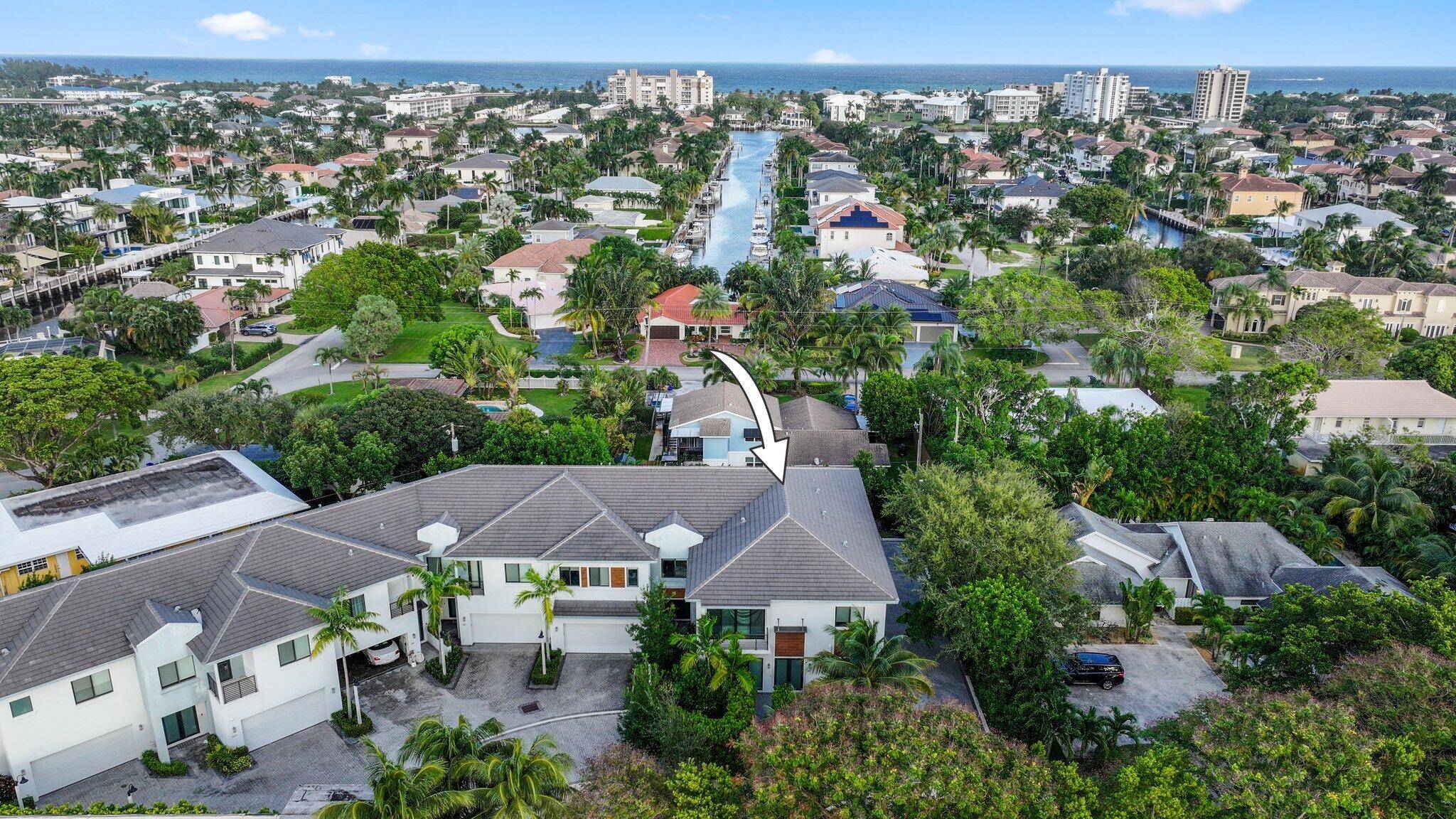 Welcome to this stunning newer construction townhome, ideally located just east of Federal Hwy in the highly sought after waterfront community of Tropic Isle, in East Delray Beach.