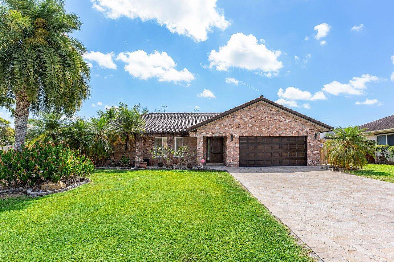 Welcome to 21786 Banyanwood Rd, a beautifully upgraded one story home in the highly sought after community of The Pines at Boca Del Mar.
