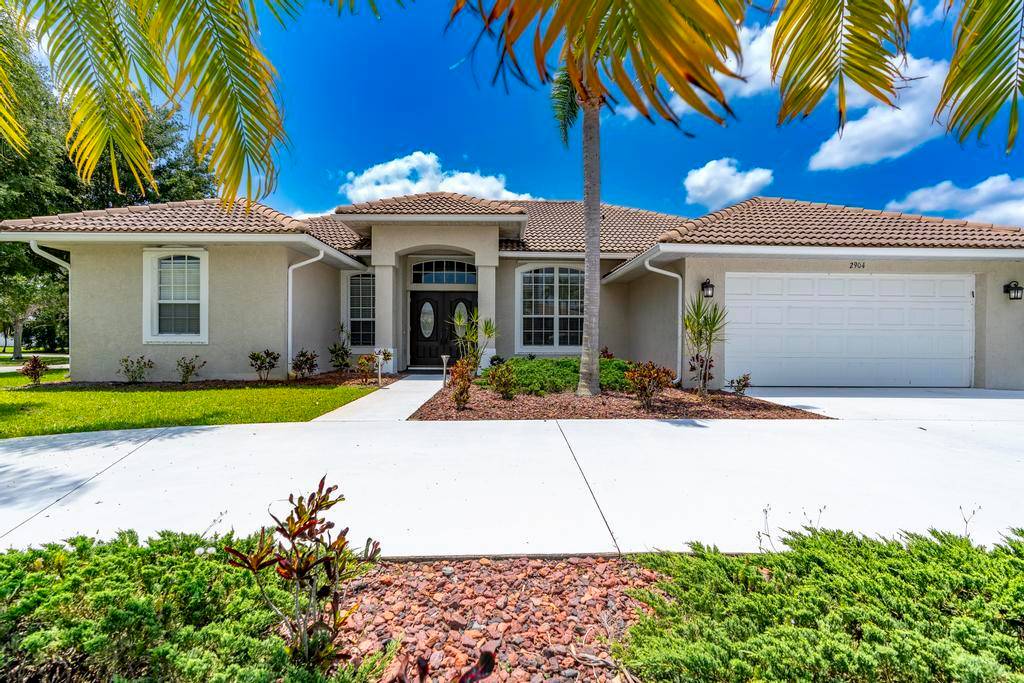 Immaculate 3 bedroom home with den office on a spacious corner lot with circular drive.