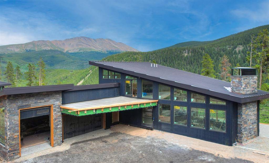 Perched on a sunny, private ridgeline with unobstructed, panoramic views, this custom retreat defines luxury.