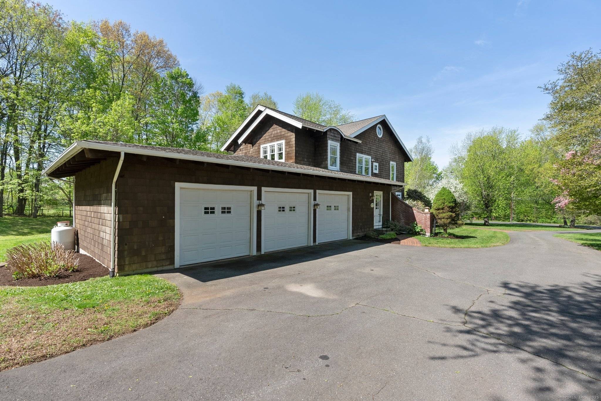 Nestled in Simsbury's East Weatogue Historic District, this notable Arts Crafts home blends timeless New England charm with refined architectural detail.