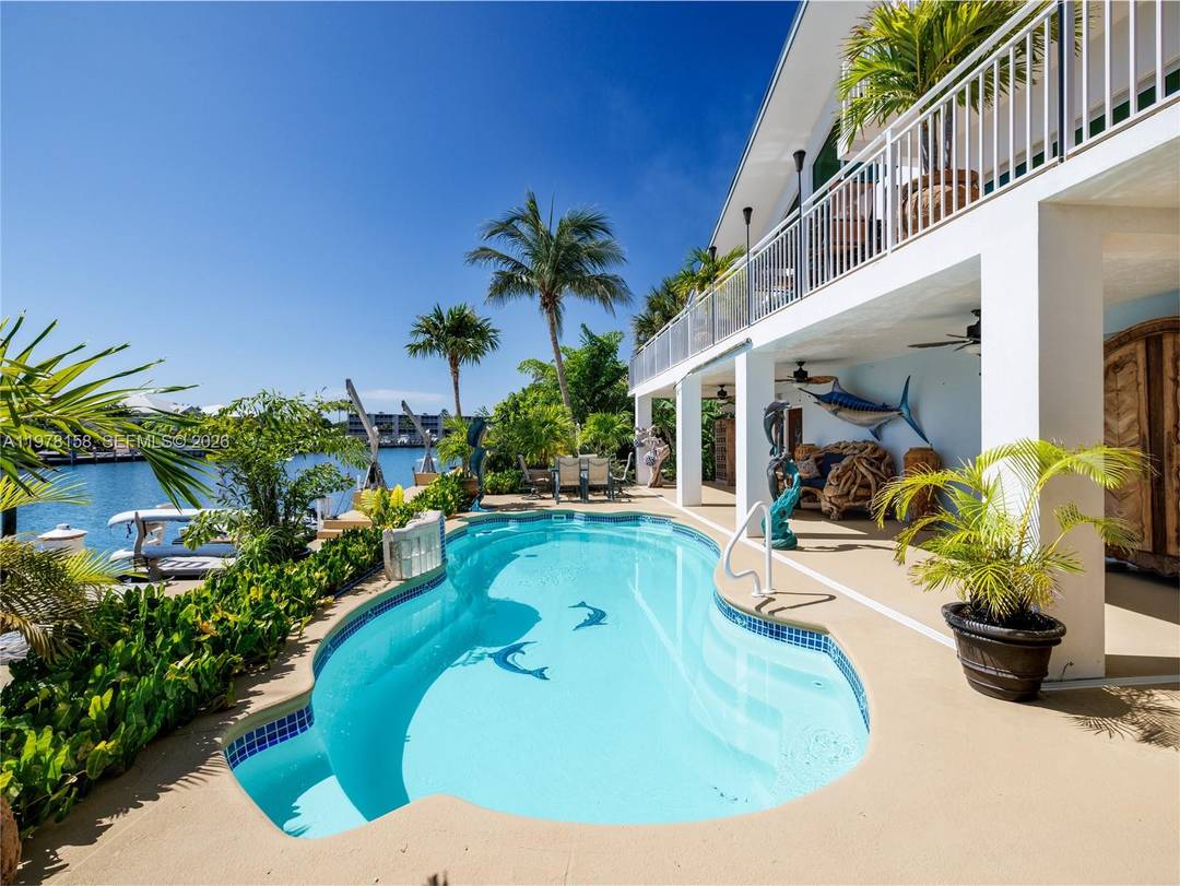 A rare waterfront estate along a 200 foot wide canal with a 110 foot dock and direct ocean access, capturing the essence of Florida Keys living.