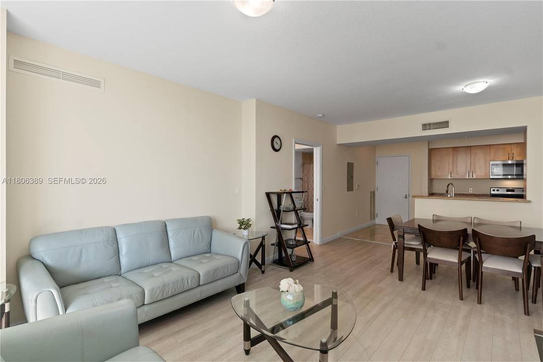 Discover comfort and convenience in this spacious condo featuring an open kitchen, large bedrooms with en suite bathrooms, impact windows, in unit washer dryer, and a generous pantry.