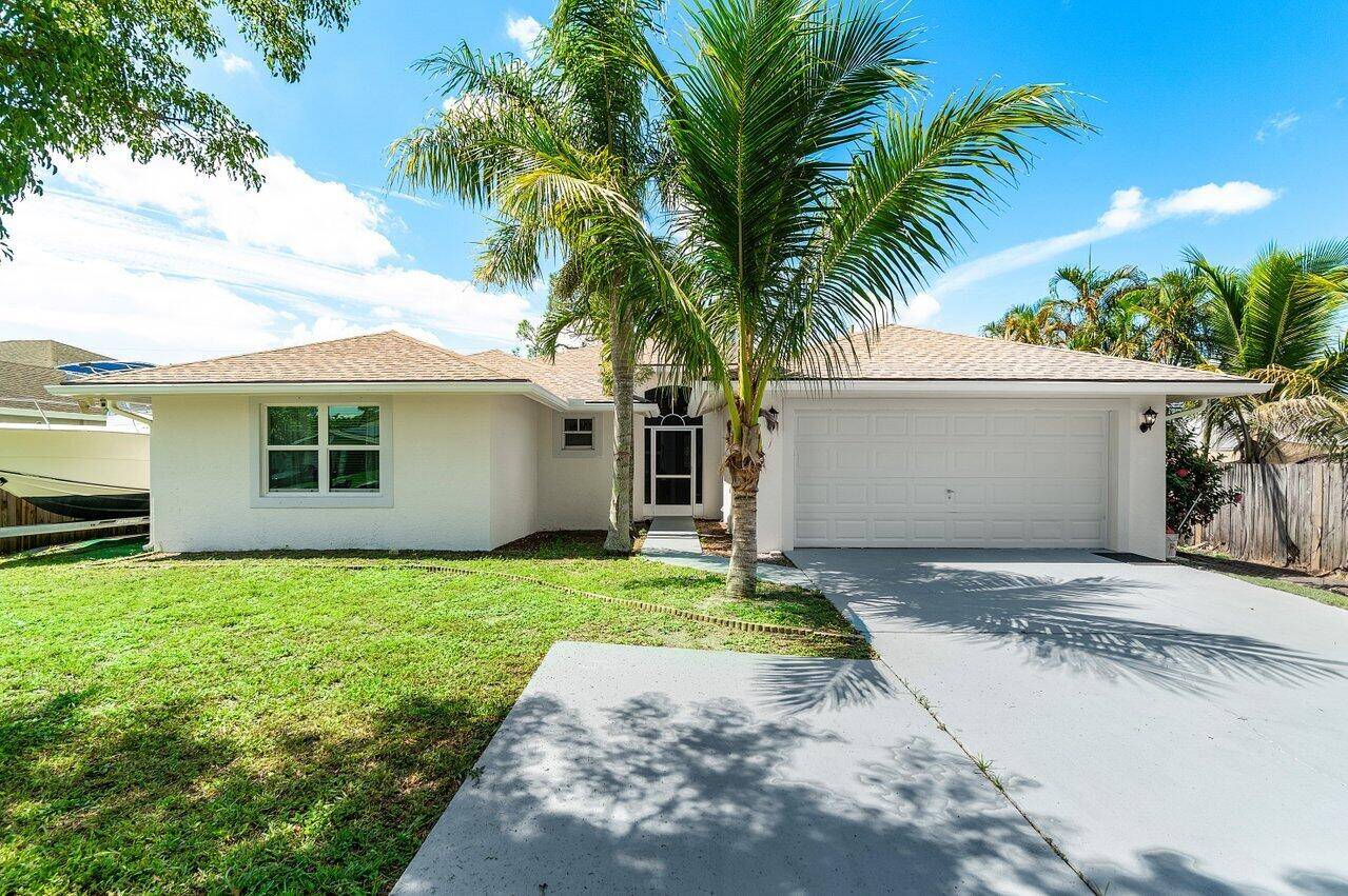 Welcome to this beautifully maintained 3 bedroom, 2 bathroom single family home in Lake Worth with NO HOA or restrictions bring your boat, RV, or pets !