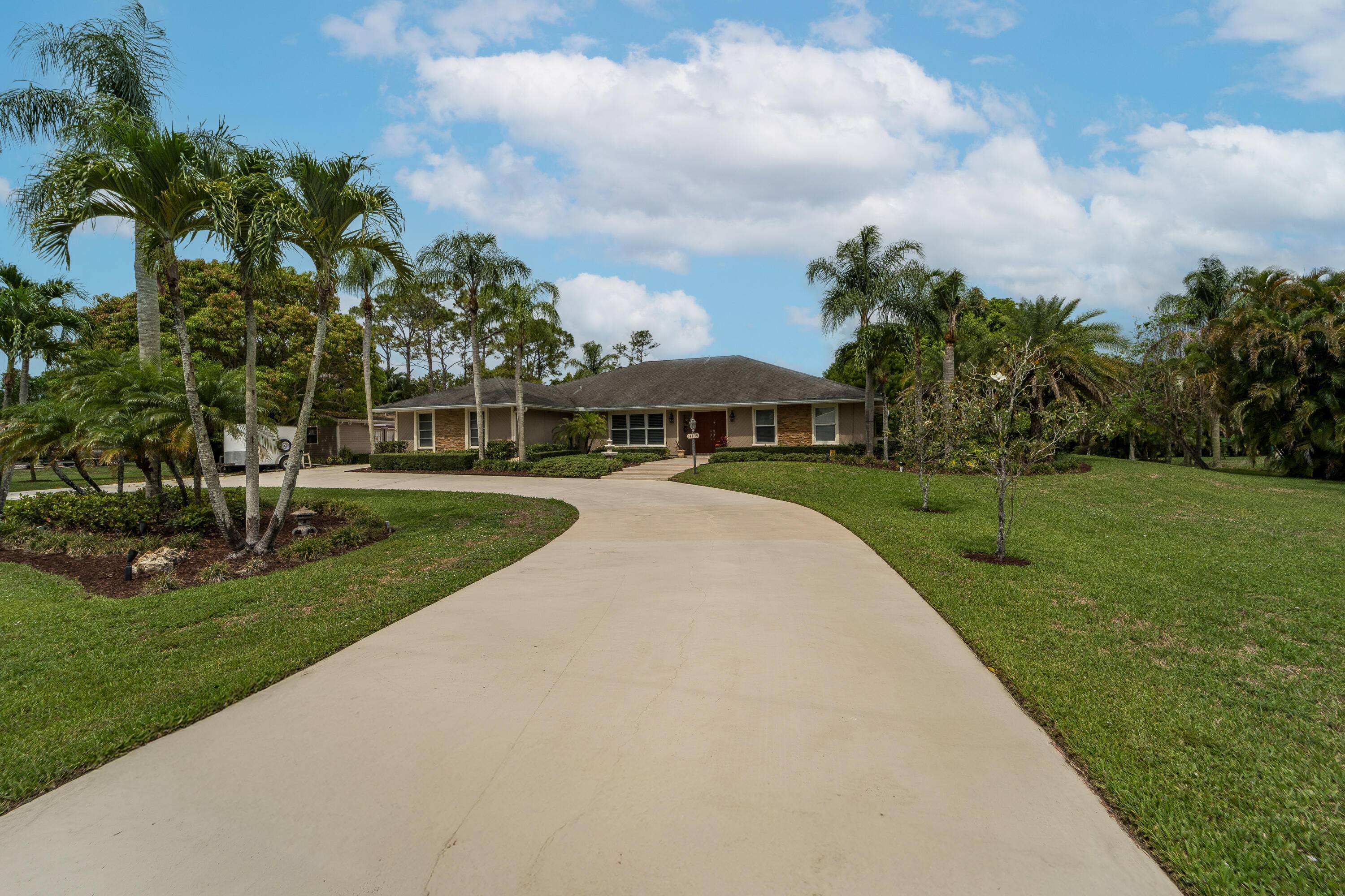 Welcome to over an acre of lush landscaped property conveniently located to major shopping, entertainment, sports, dining, amazing beaches and coming soon the Alan B.