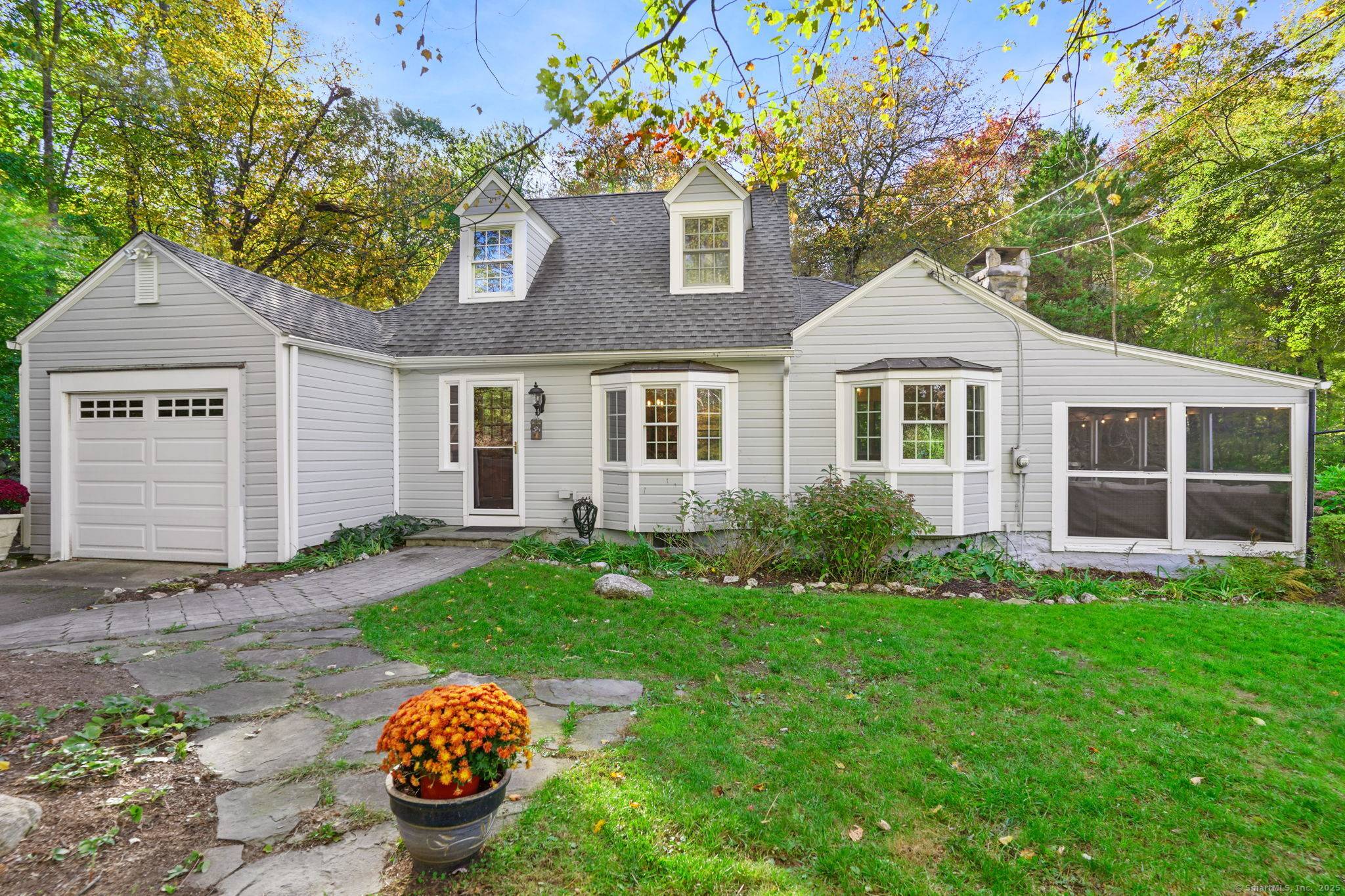 Welcome to this quintessential Connecticut Cape an enchanting retreat on 2 acres, a true gardener's paradise nature lover's dream.