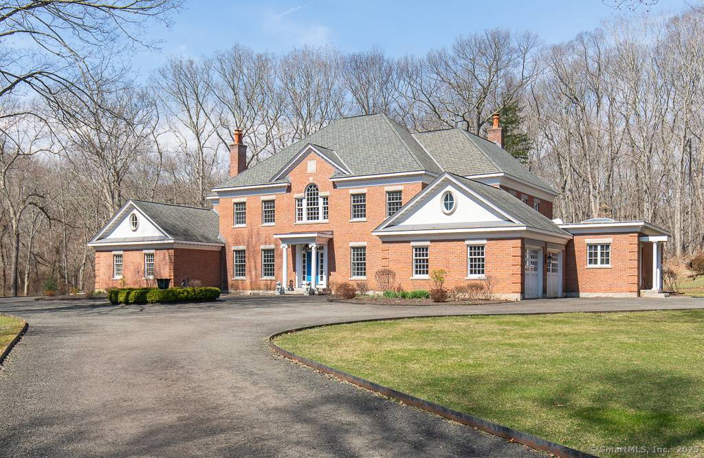 Come see this stately custom Brick English Georgian home in sought after Madison CT, nestled on a sprawling 5.
