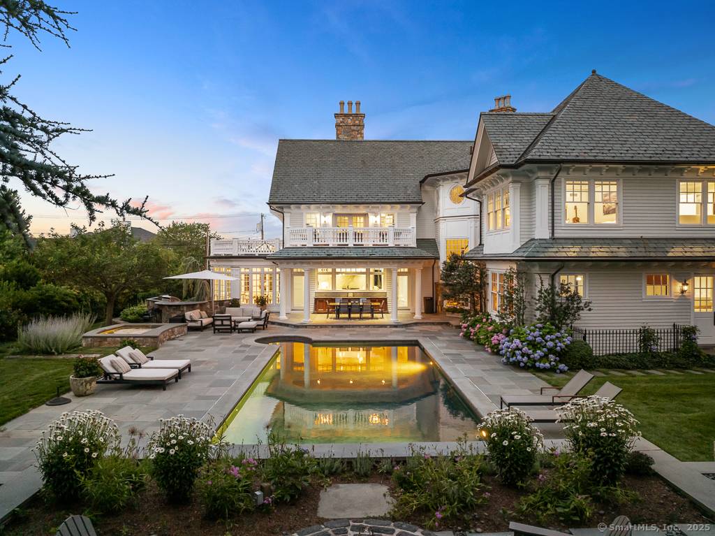Experience the unparalleled luxury of this exquisite Compo Beach seaside home, a masterpiece of design and craftsmanship, designed by renowned architect Peter Cadoux.