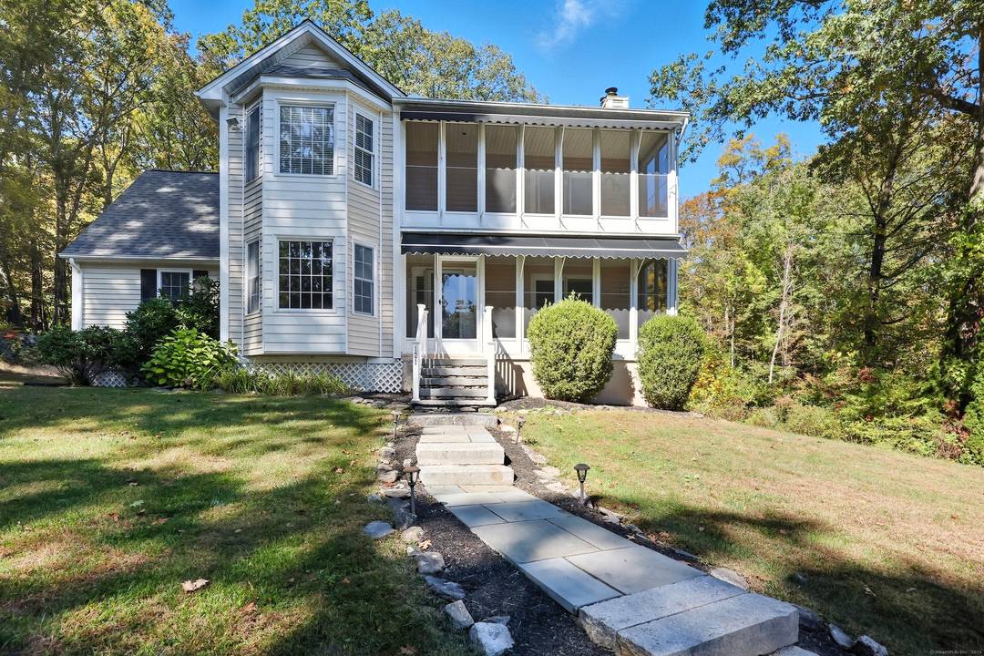 Discover lakeside living at its finest with this renovated 5 bedroom, 4 bath family estate set privately on a full acre overlooking picturesque Highland Lake.