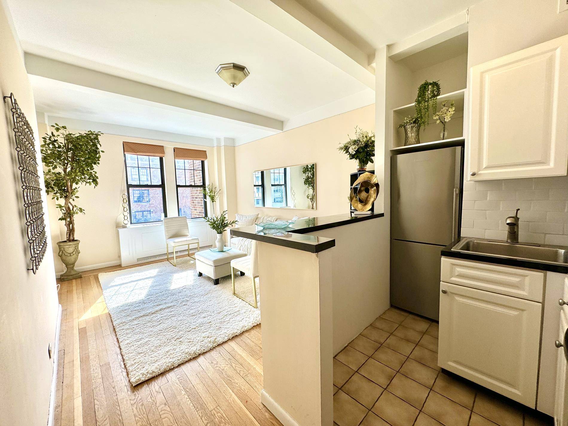 THE RESIDENCEWOW ! You will fall in love with this spectacular sun blasted studio with south city views and corner living room, just steps off Central Park.