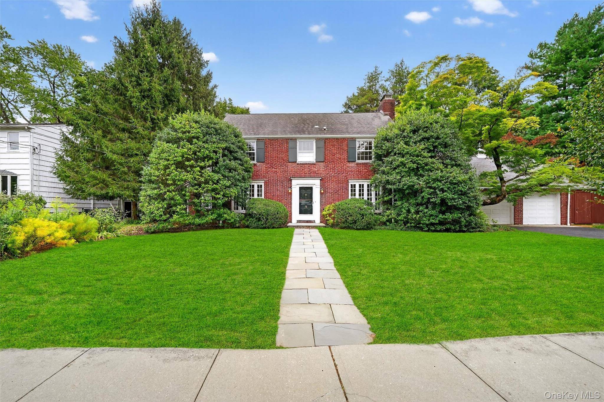 Nestled on one of the most sought after streets in the Village of Croton, this stately 1932 brick Colonial effortlessly blends timeless elegance with curated modern sophistication.