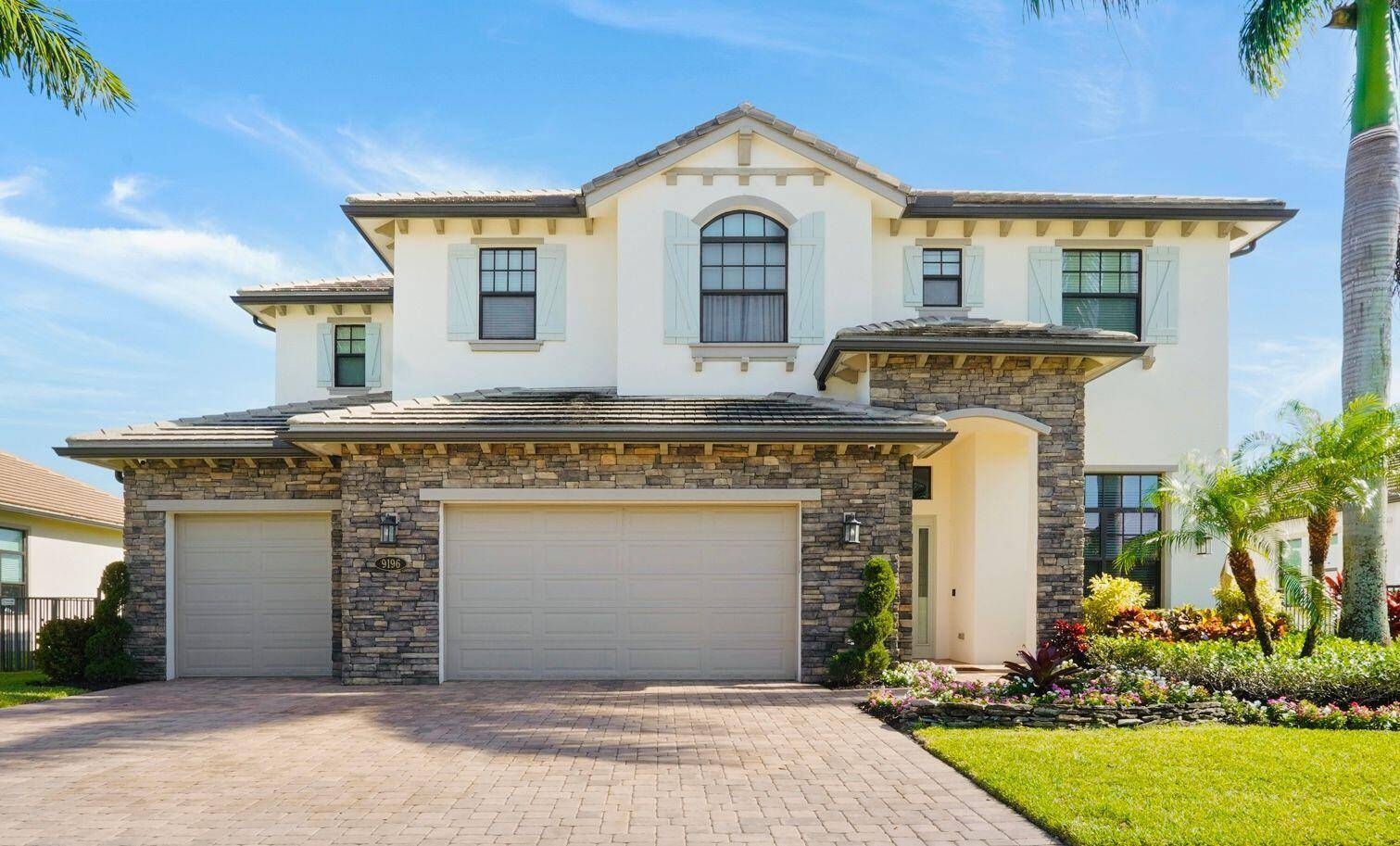Welcome to 9196 Grand Prix Lane, an exquisite modern residence in the prestigious Palm Meadows Estates of Boynton Beach, FL.