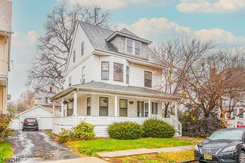 Welcome to this spacious Colonial located in Newark's desirable Forest Hill section, where the charming porch sets the stage for timeless architectural appeal.