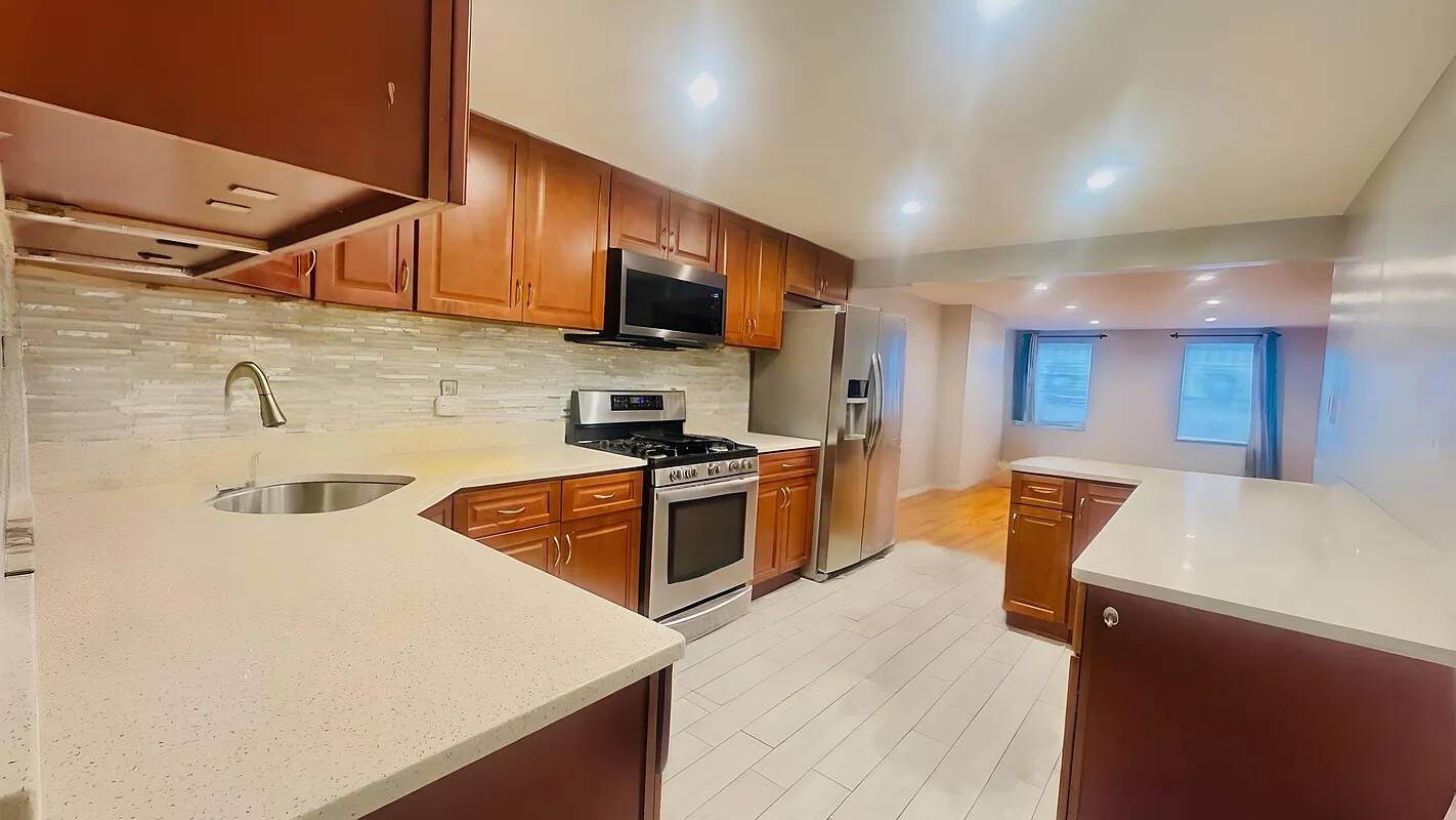 Welcome to this inviting duplex apartment located on the first floor of a charming two family house built in 1899, situated in the peaceful Cypress Hills neighborhood.