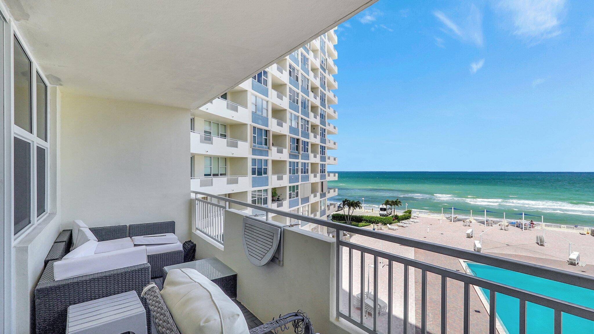 Live where others vacation in this rare direct oceanfront gem at 3180 S Ocean Drive 414, Hallandale Beach.