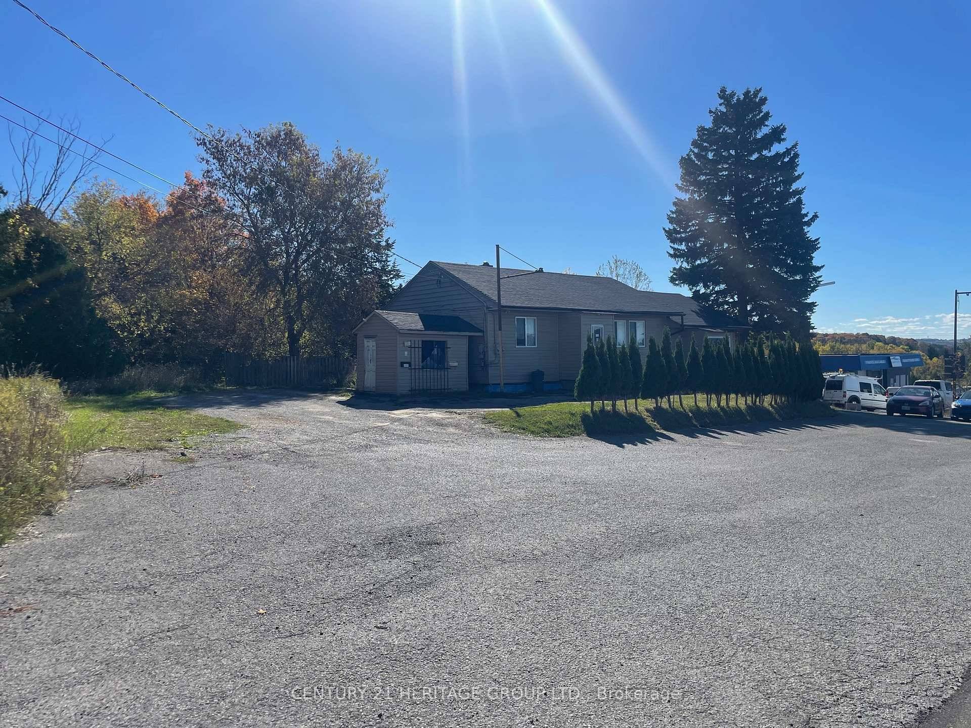 Outstanding opportunity to lease a versatile commercial lot with an existing 3 unit bungalow, ideally located just off Highway 400.