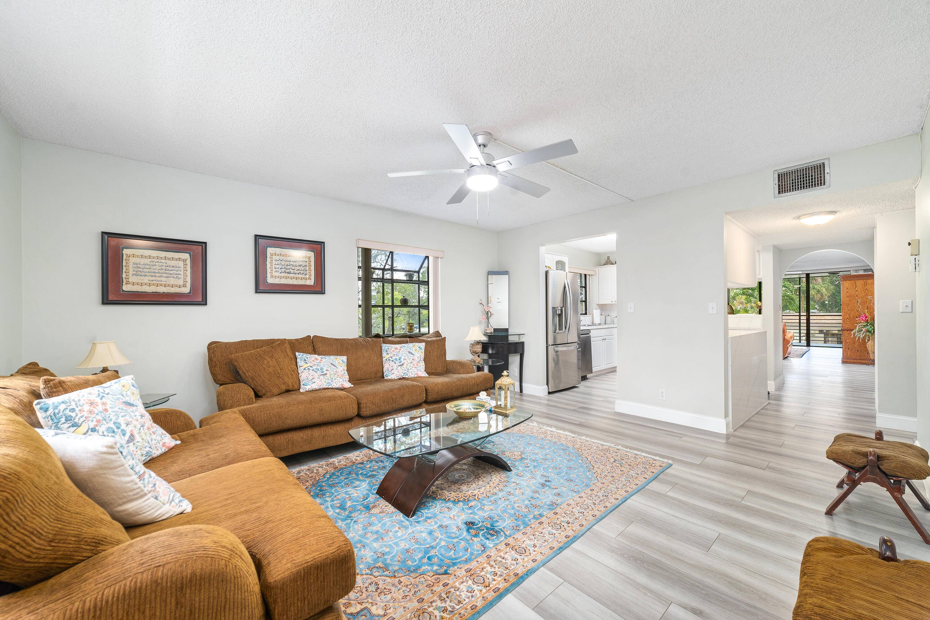 Welcome to this spacious corner unit, the largest model in the building, located in the sought after gated community of Bonaire Woodmont.
