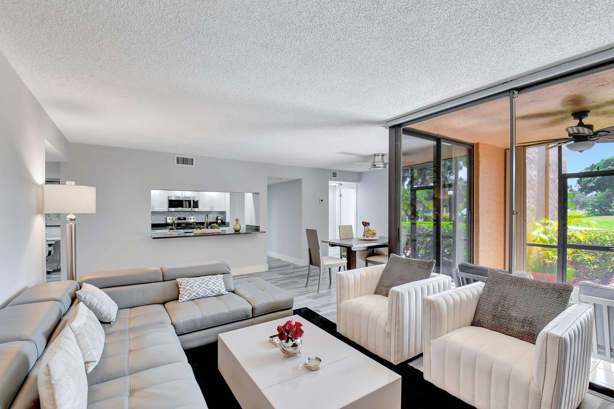 Furnished and designer inspired ground floor 2 2 available for rent in the highly desirable Delray Racquet Club.
