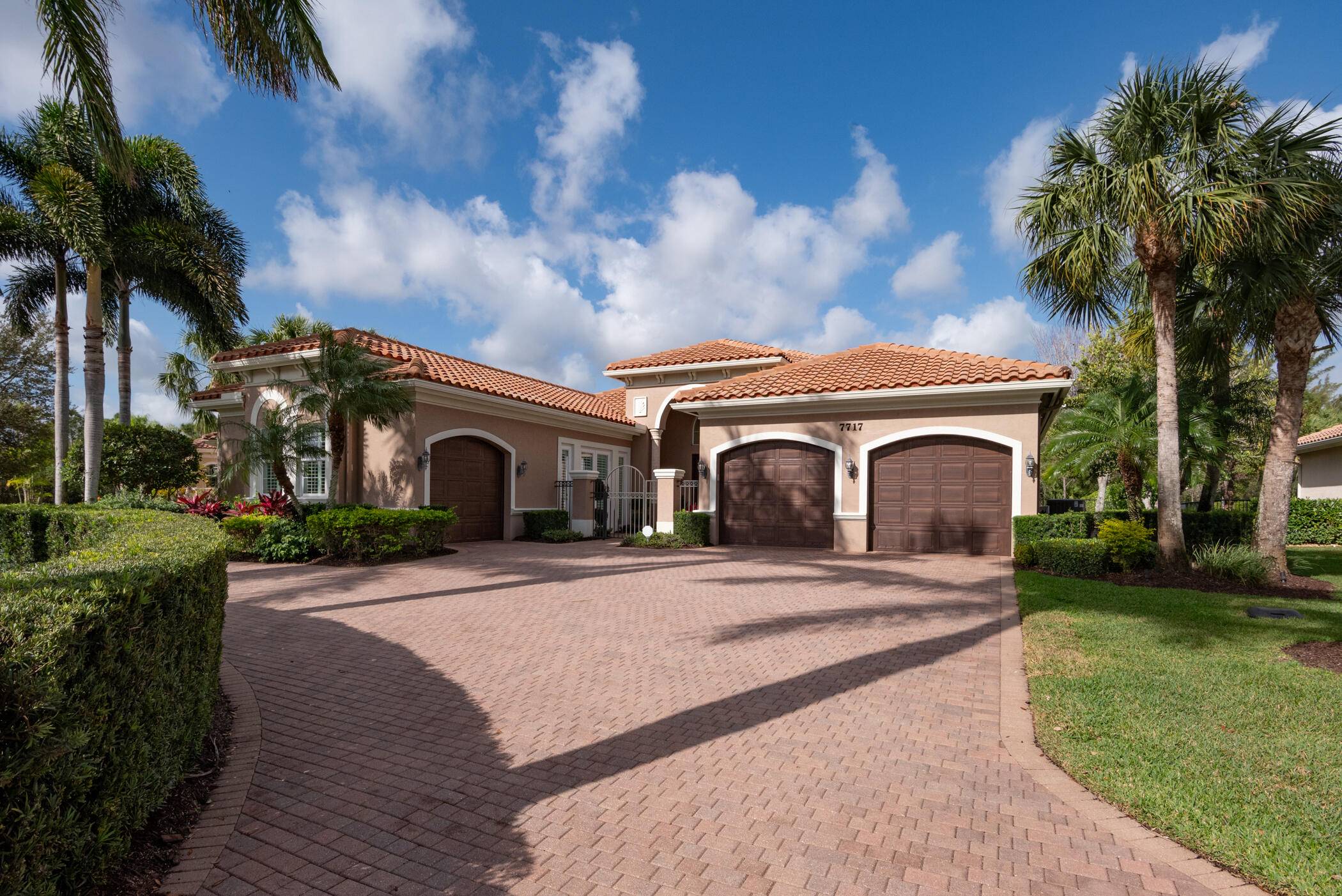 7717 Eden Ridge Way is set on a half acre lot on a quiet cul de sac which is surrounded by beautiful lakes and preserves in Palm Beach Gardens.