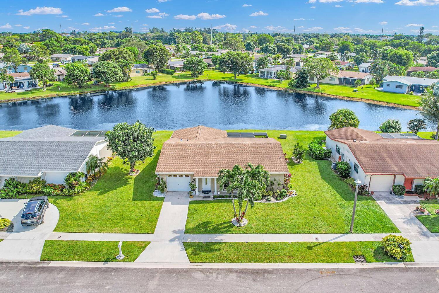 WATERFRONT Pet Friendly, Fully RENOVATED Home in 2023 with 2 bedrooms, 2 full bathrooms, private back yard with large patio, attached garage and new Impact windows.