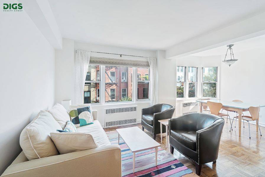 Picturesque brownstone garden views and all day light from your eight large Eastern facing windows !