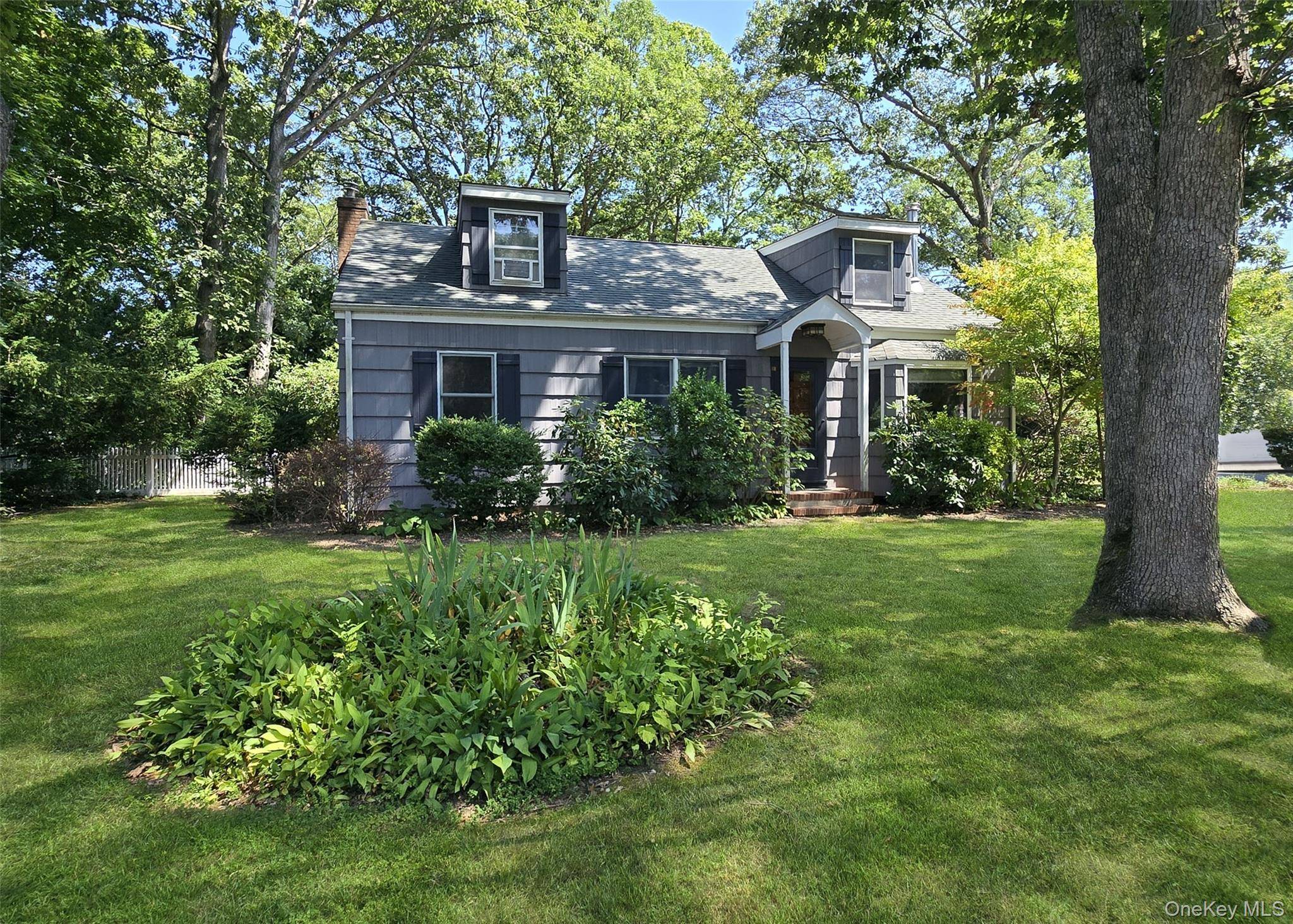 Charming Cape on Prime Corner Lot !
