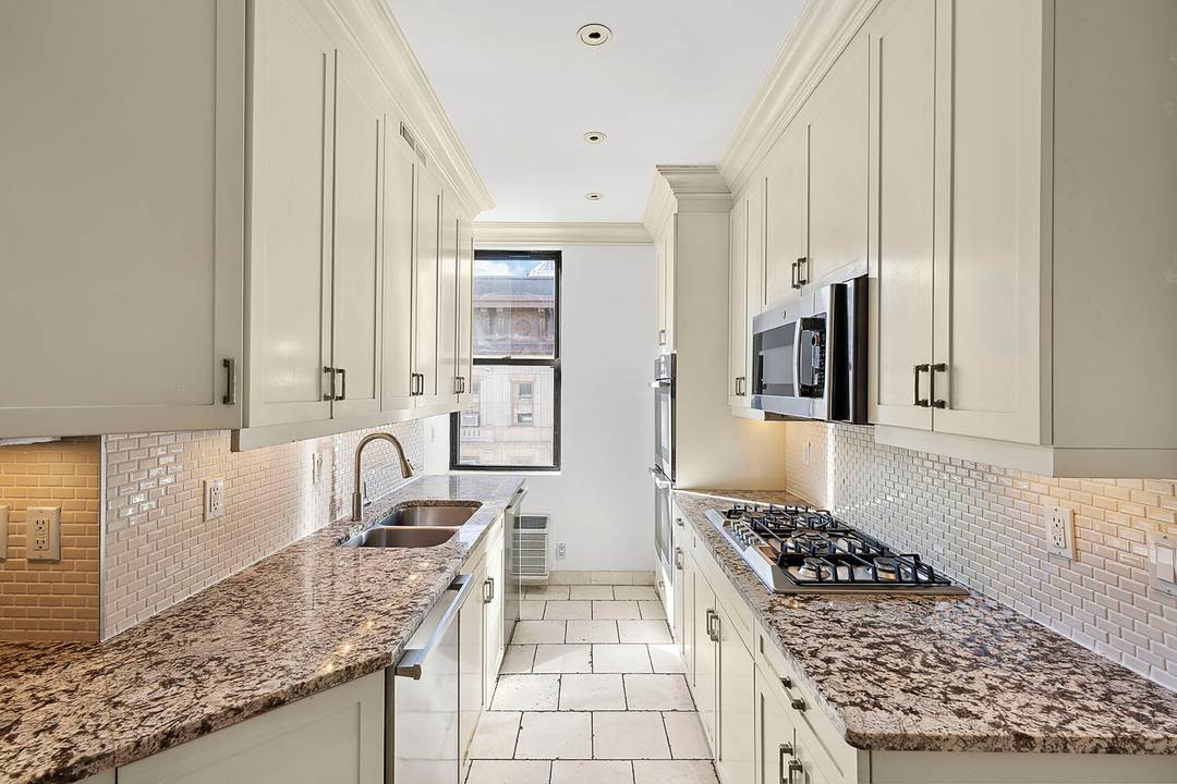 Elegant and spacious four bedroom, three bathroom condo on the top floor of a luxurious pre war building at 905 West End Avenue.