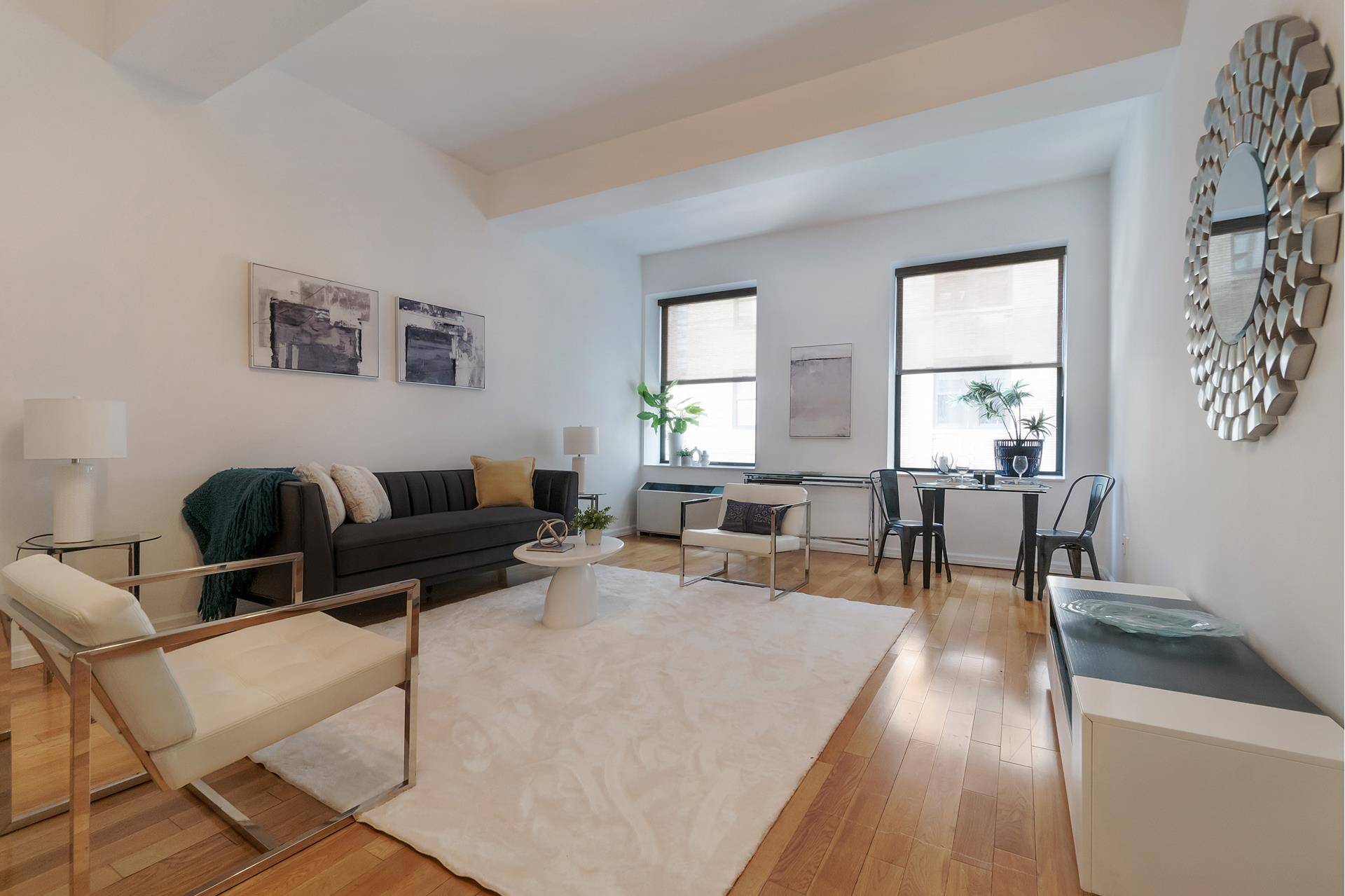 Welcome to Residence 425 at the iconic 99 John Deco Lofts a rarely available 1, 096 square foot loft currently configured as a 1 Bedroom home office in the heart ...