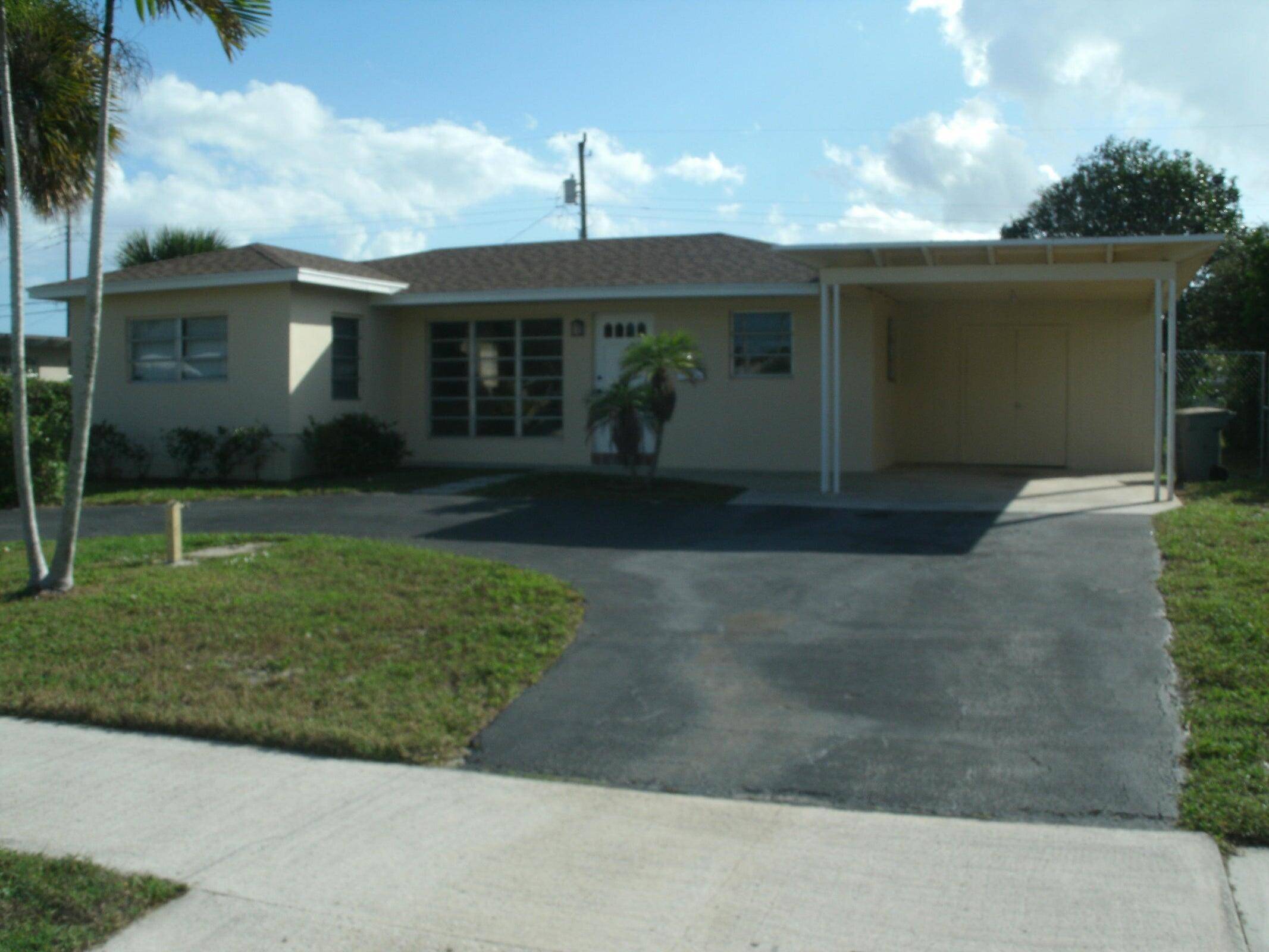 2 bedrooms, 2 full bathrooms, 1 carport POOL single family home in Lake Park.