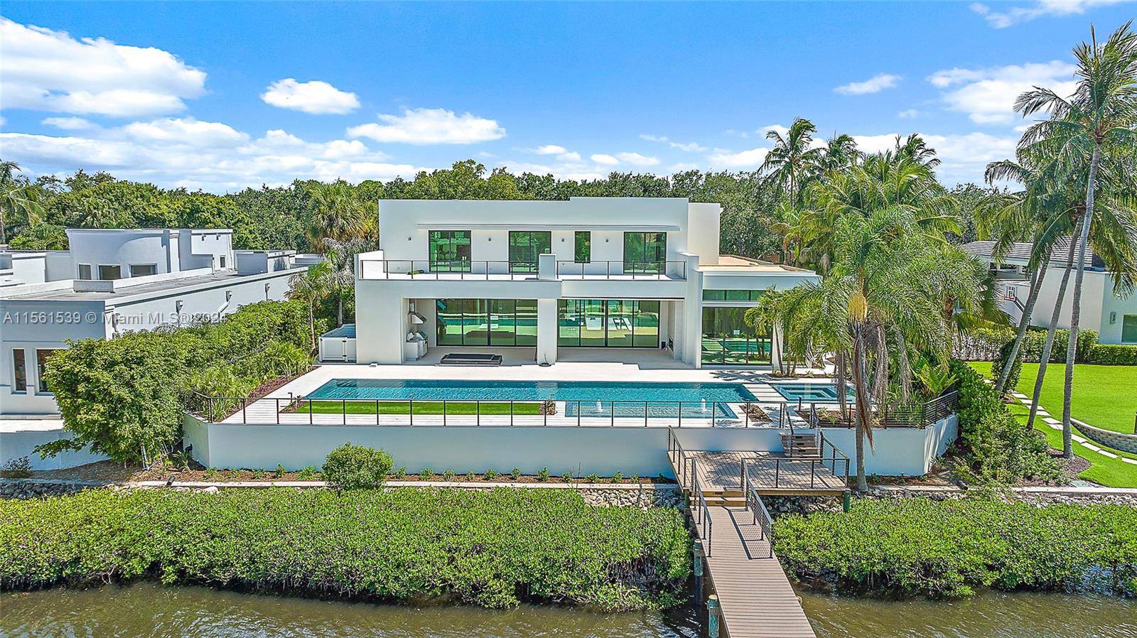 Welcome to 410 Mariner Drive, a contemporary waterfront masterpiece in the prestigious enclave of Admirals Cove.