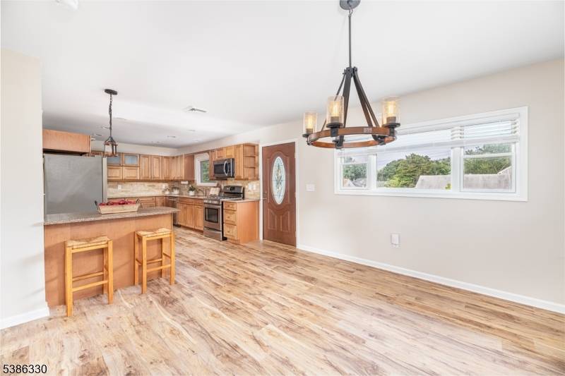 Welcome to this beautifully renovated ranch with bonus ground level storage and close access to the county park, a pedestrian and bike path of over six miles, playgrounds, pickle ball, ...
