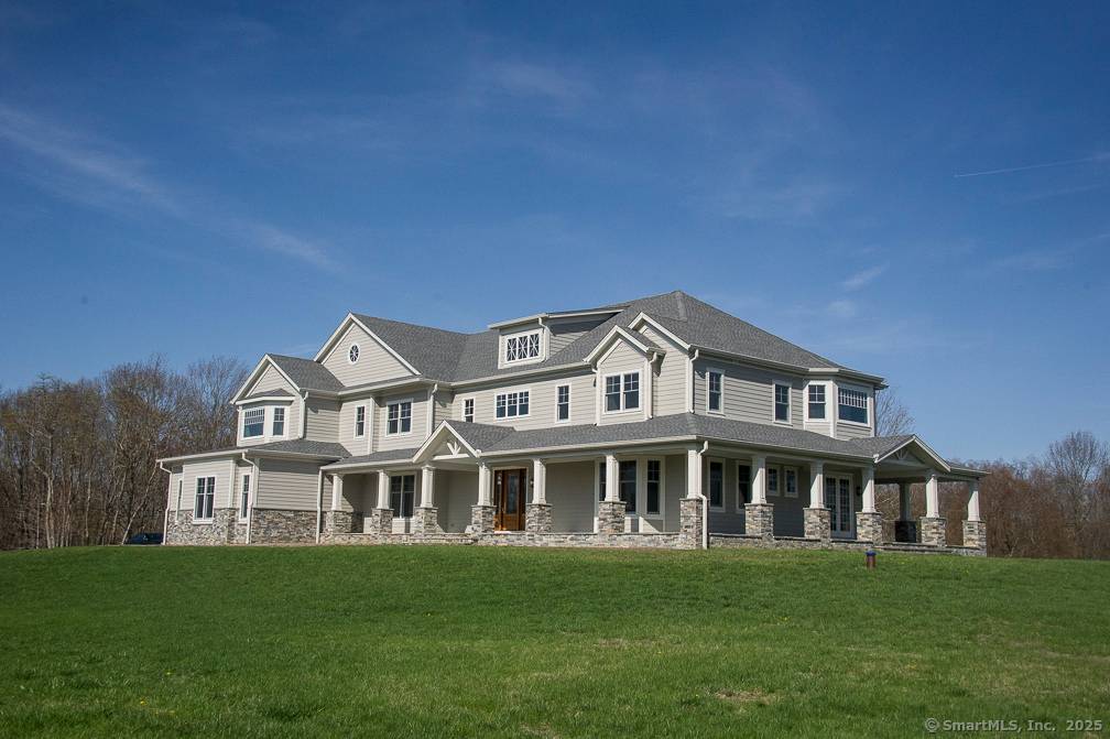 This pristine, like new estate home sits majestically on 10 acres on the historic Atchison Farm homestead in rural Sherman CT.