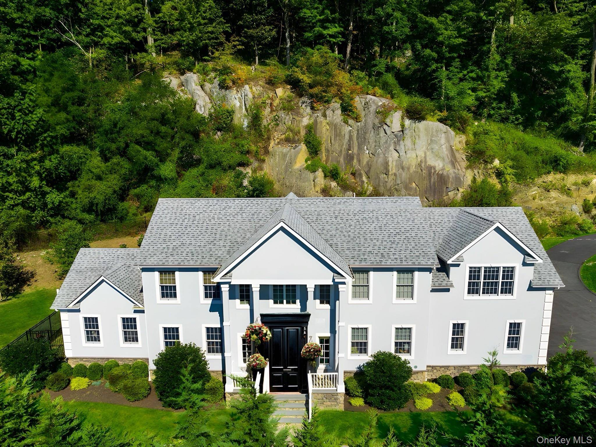 This sophisticated four bedroom residence offers an ideal blend of convenience and tranquility just north of New York City.