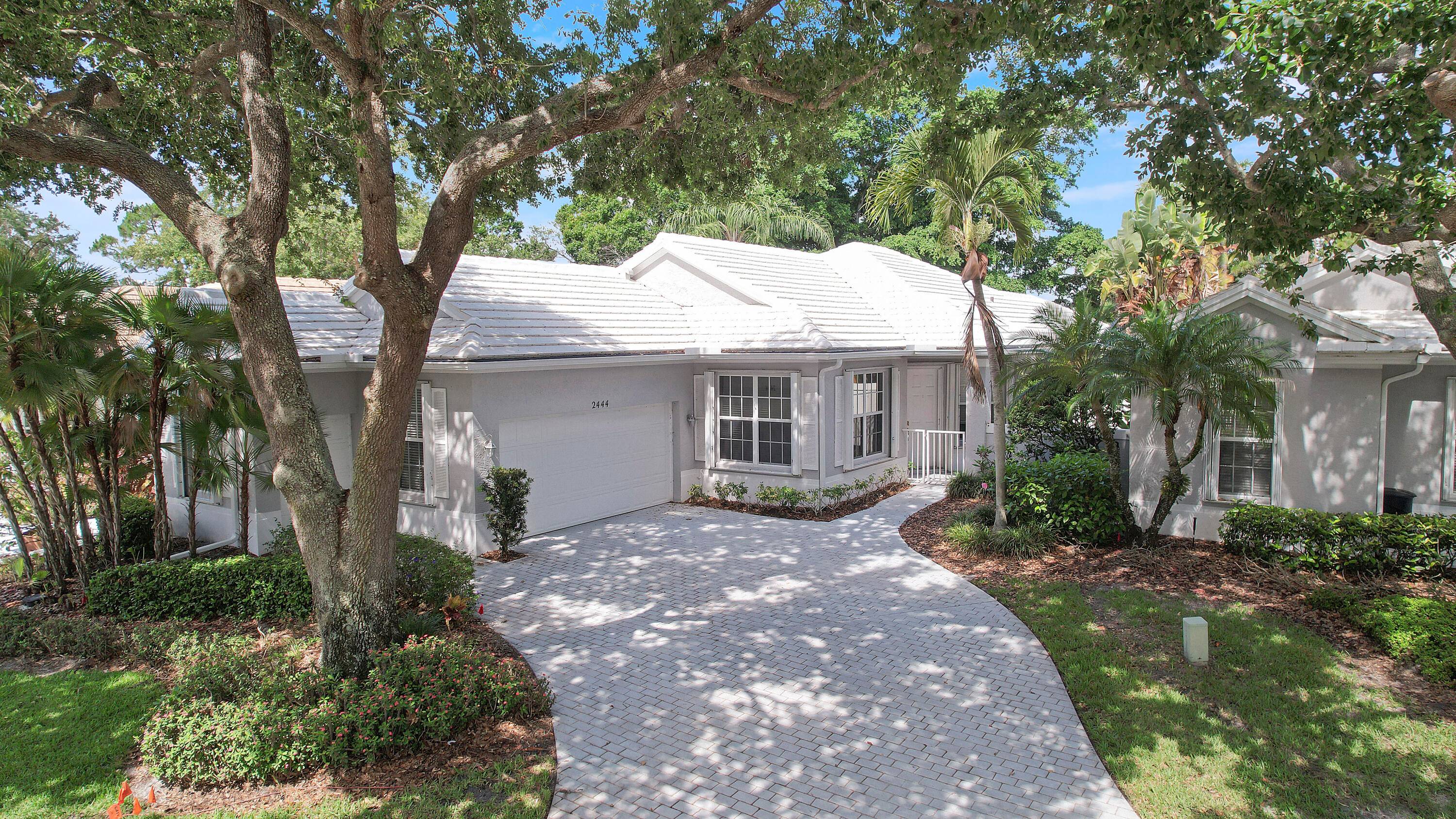 Located in one of Palm City's most desirable gated communities, this charming home offers golf course views and a low maintenance lifestyle.