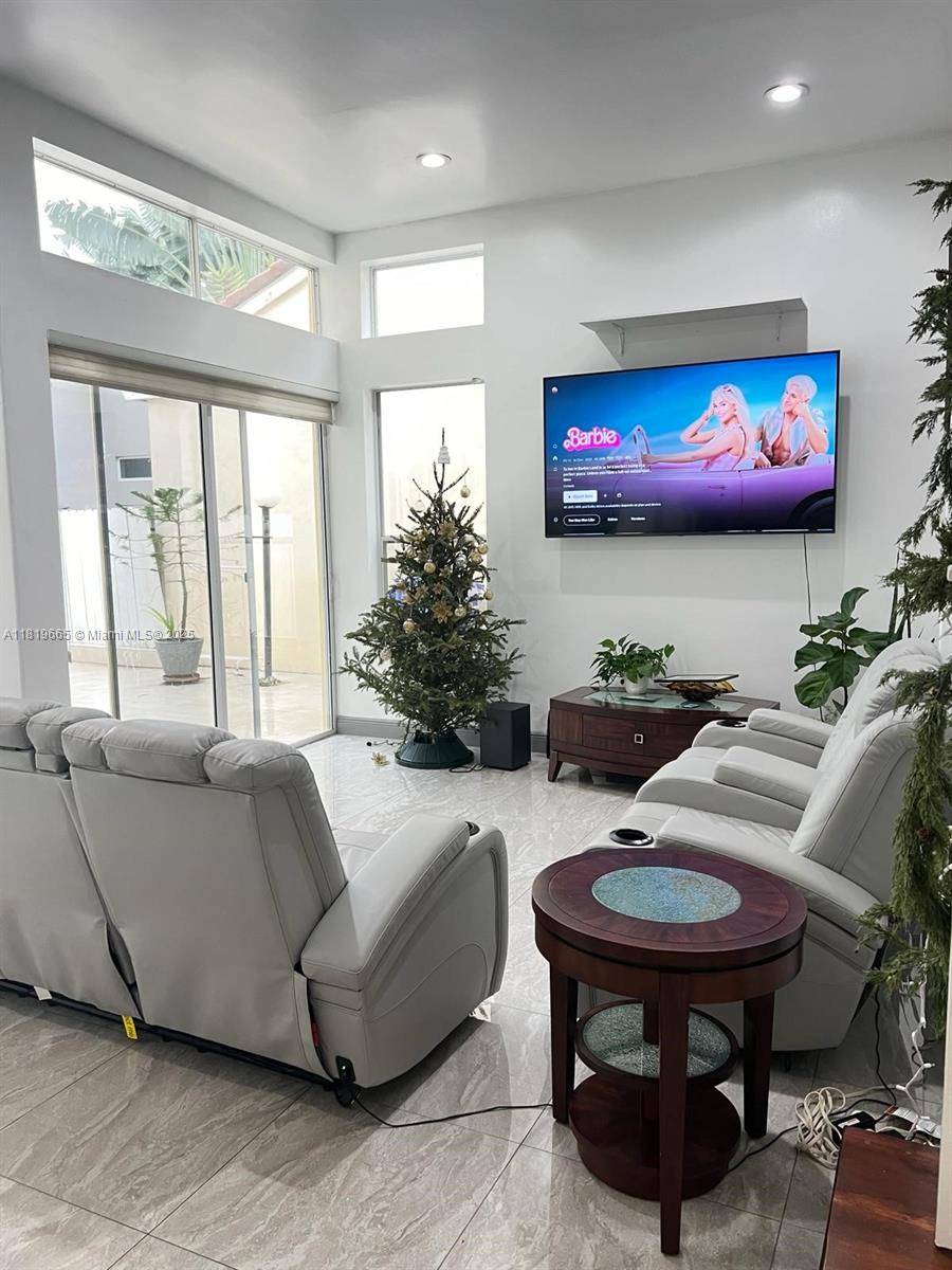 THIS 4 2. 5 LOFT SINGLE FAMILY HOME HAS A LARGE 2 CAR GARAGE IN A 24 HOUR GATED COMMUNITY JUST 1 MILE FROM THE OCEAN.