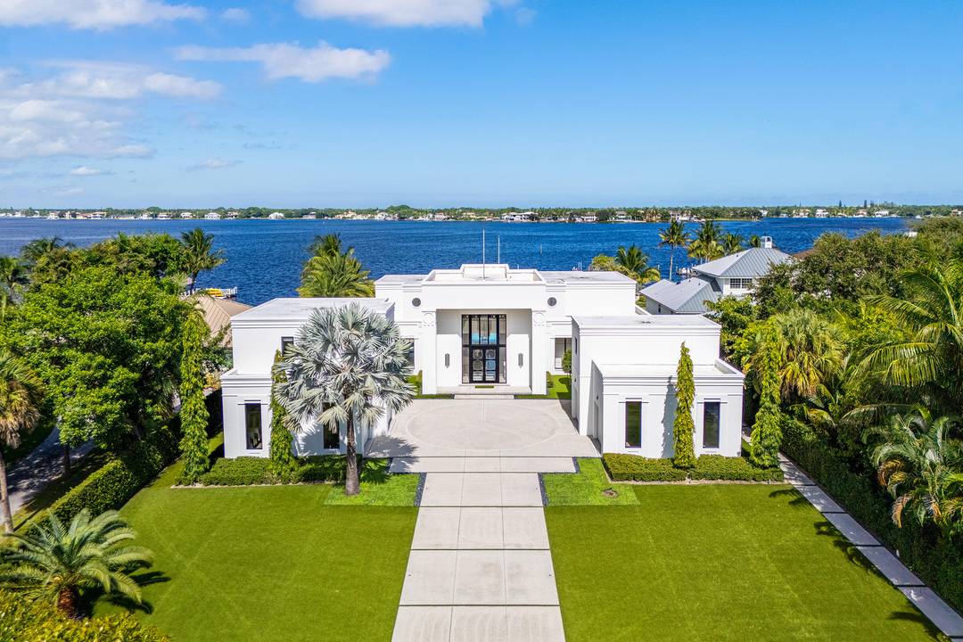 Experience the art of luxury living in this spectacular modern estate on the scenic Loxahatchee River in Jupiter, Florida.