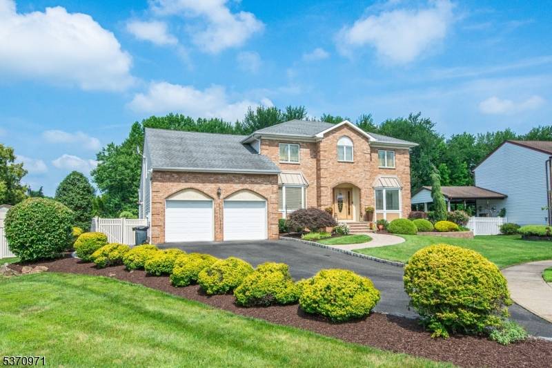 Welcome to 14 Winfield Court a stunning, spacious brick colonial nestled on one of the most desirable cul de sacs in town.