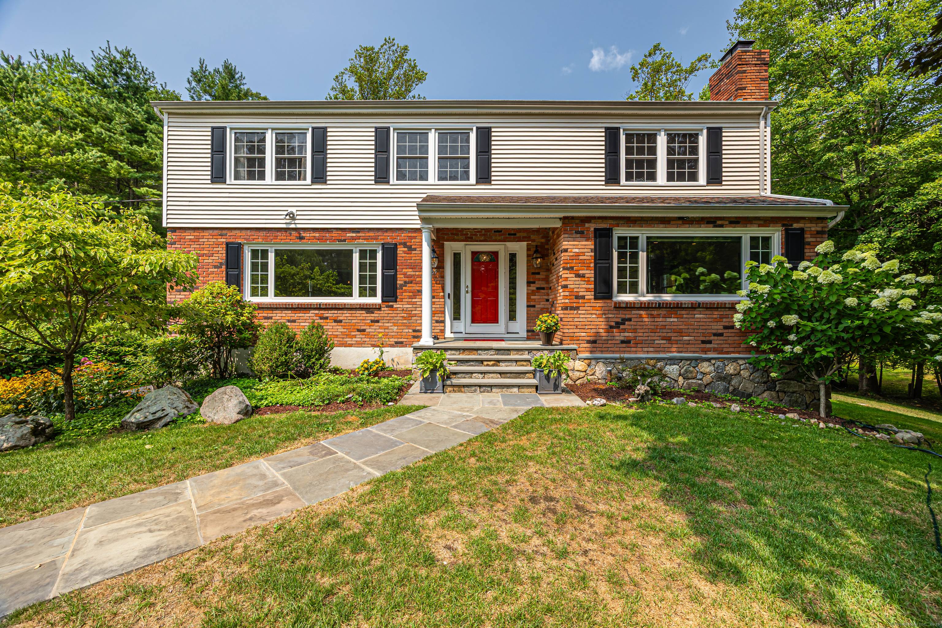 Welcome to 65 Malibu Road, a beautifully updated Colonial set on a quiet cul de sac in desirable North Stamford.