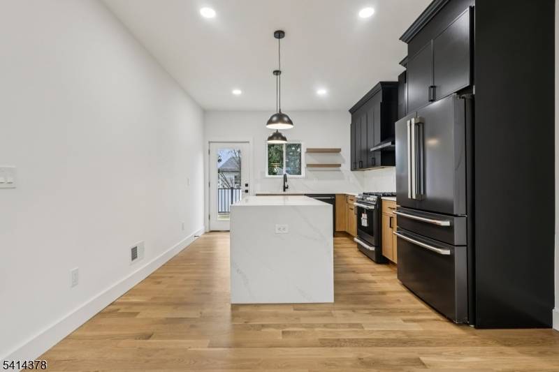 Newly built north facing home with 9 foot ceilings, a first floor bedroom and full bath, and approximately 5 minutes to NJ Transit with direct NYC routes.