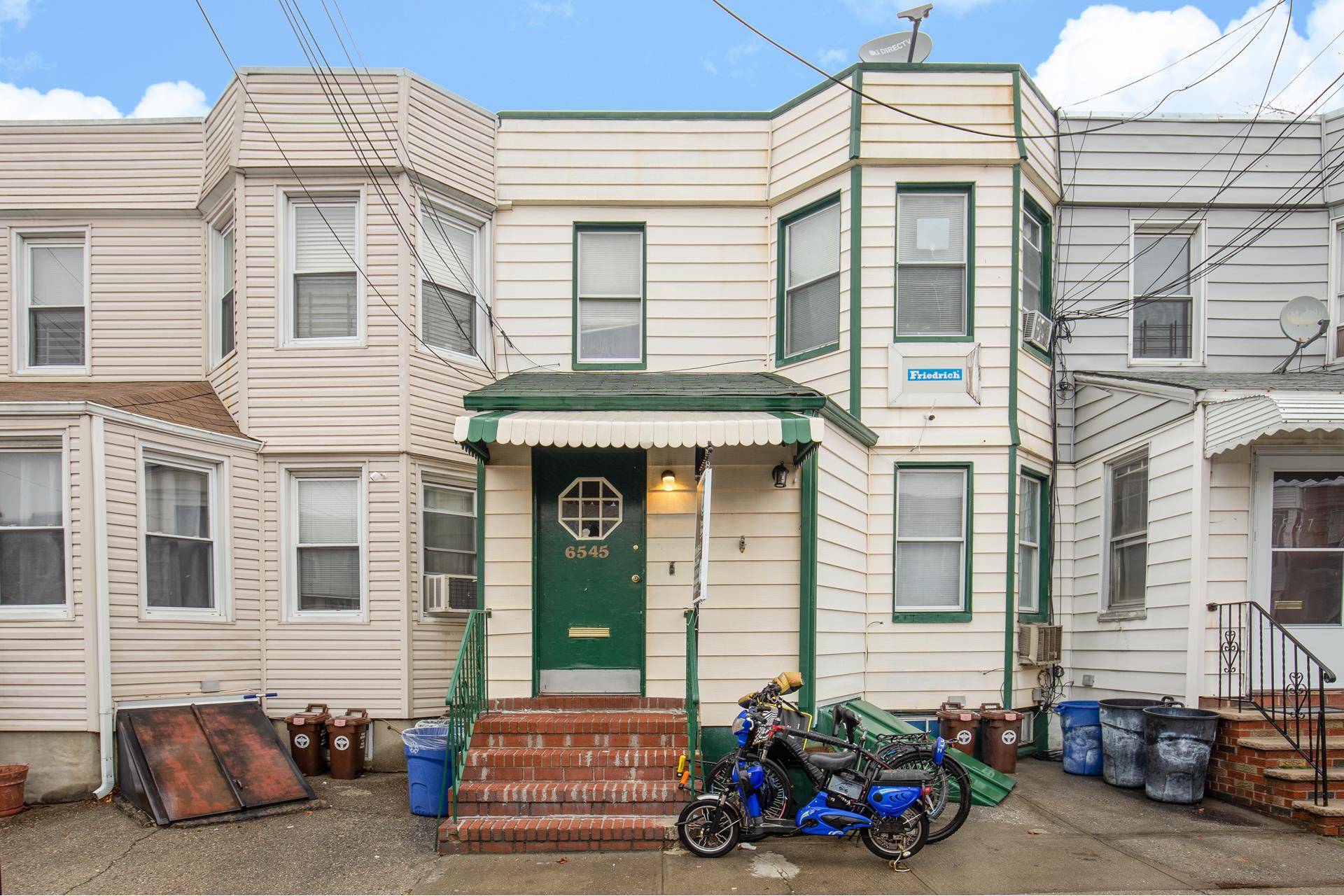 Terrific multi family home, just a block from the subway, in the very desirable area of Middle Village !