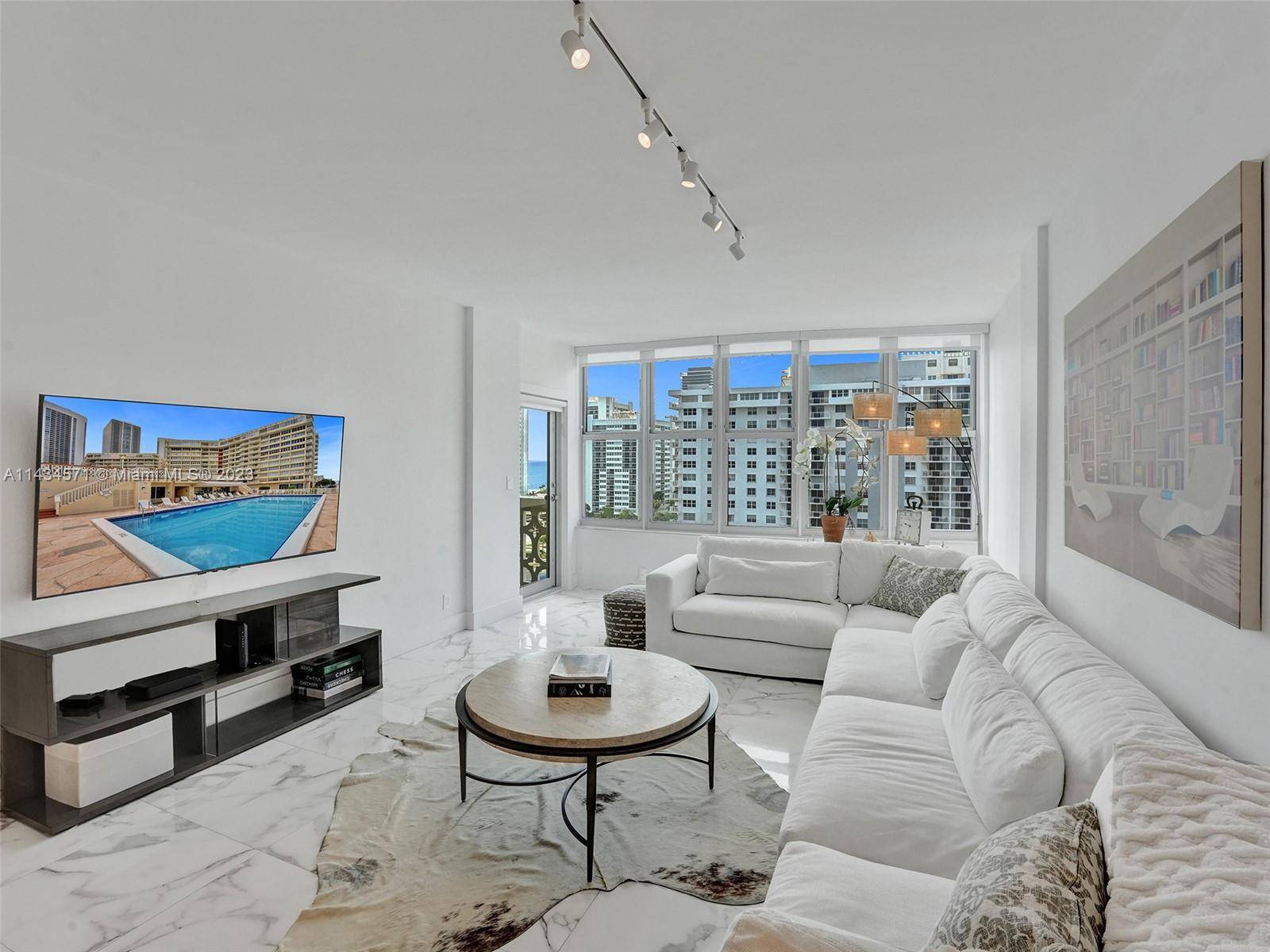 Exquisite penthouse in the heart of Hallandale beach directly across the street from the ocean with spectacular views of the city, skyline ocean.
